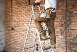 residential-renovation-electrician-with-tools-working-construction-site-repair-1024x698